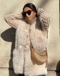 Avilego Women Winter Fall Trendy Fuzzy Faux Fur Sleeveless Vest Cozy Coats Plush Waistcoat Outerwear with Horn Button at Amazon Women's Coats Shop