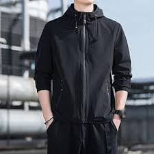 JEsilunmaMY Men's Loose Sportwear Hood Jacket Fall Windproof Casual Bomber Jacket Lightweight Windbreaker with Zip Pocket (Black,Medium) at Amazon Men's Clothing store