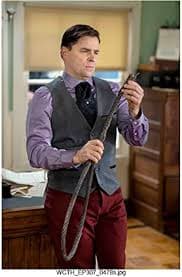 When Calls the Heart (TV Series 2014 - ) 8 Inch x 10 Inch photograph Kavan Smith Grey Vest Over Purple Shirt w/Maroon Pants Leaning Against Desk kn at Amazon's Entertainment Collectibles Store
