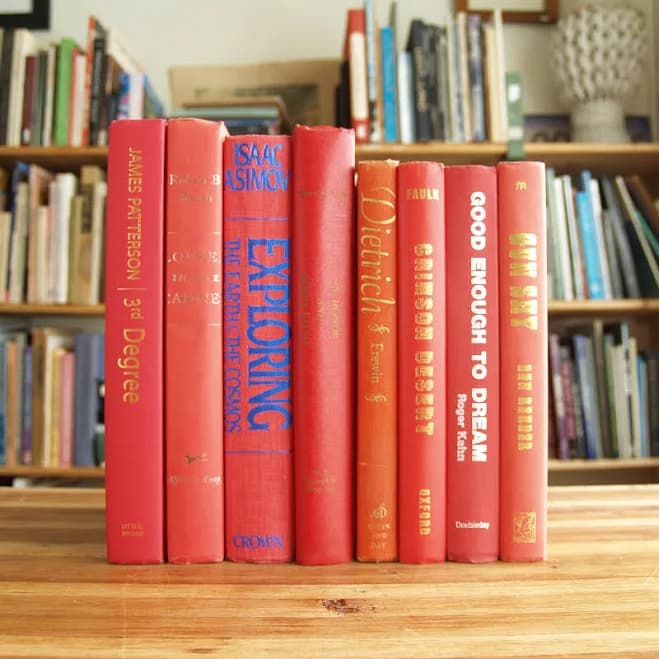 Decorative collection of eight hardcover books with red bindings - Shipping