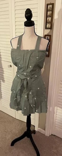 Handmade upcycled sage green bib apron with embroidered daisies, pleated design