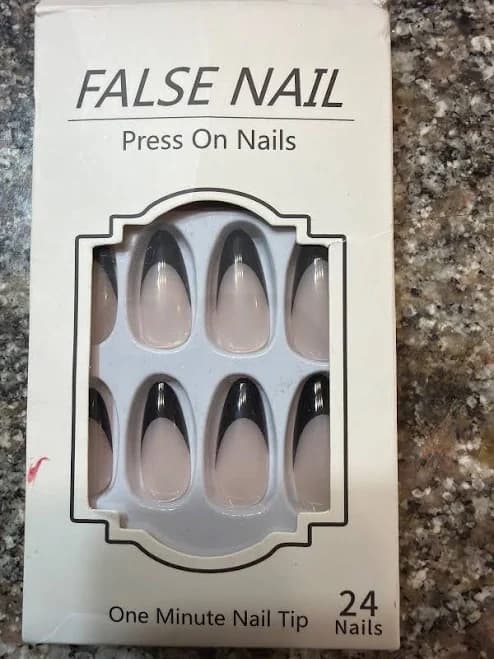 French tip press on nails, nude and black medium length.