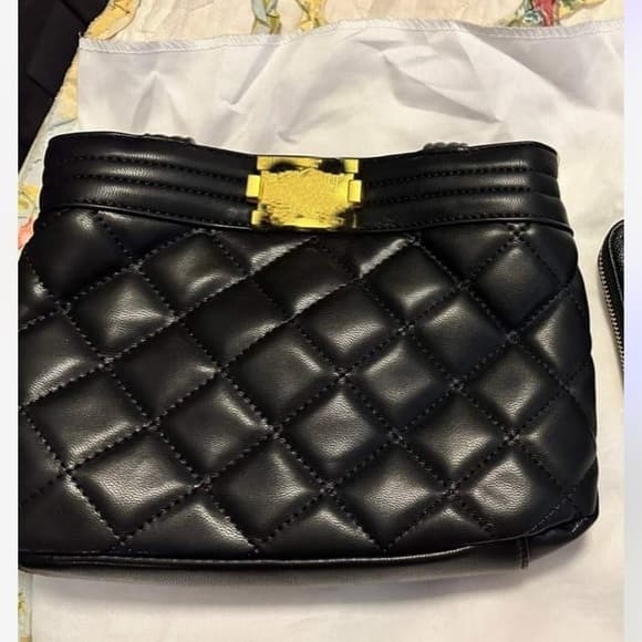 Black quilted bag with gold chain strap