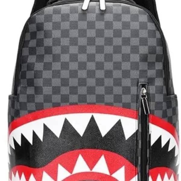 Sprayground Shark Backpack with Bold Checkerboard Design and Red Teeth Detailing