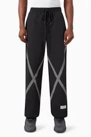 Buy The Giving Movement Black Reflective-strips Wide-leg Pants in RE-SHELL100© For Men Online | Ounass Oman