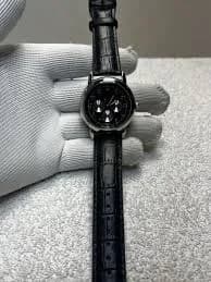 Black Dial Round Silver Tone Case Black Leather Band Watch