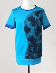 A turquoise with black lace overlay t-shirt. Size Medium