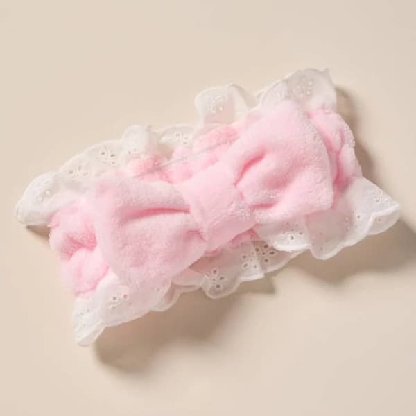 Francesca's Bow Eyelet Spa Headband