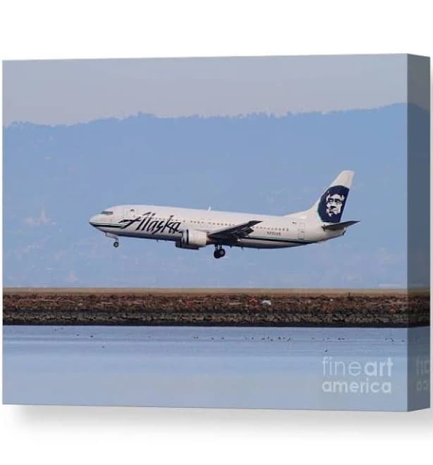 Alaska Airlines Jet Airplane At San Canvas Print by Wingsdomain Art and Photography | Alaska Airlines Plane Landing at Dusk