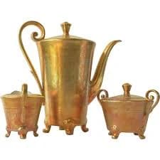 A vintage DW porcelain gilded (22ct gold ) coffee set.