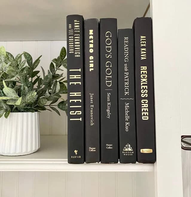 black book for home staging decor, office bookshelf decor, decorative books, bookcase decor, table books, book stack, book nook