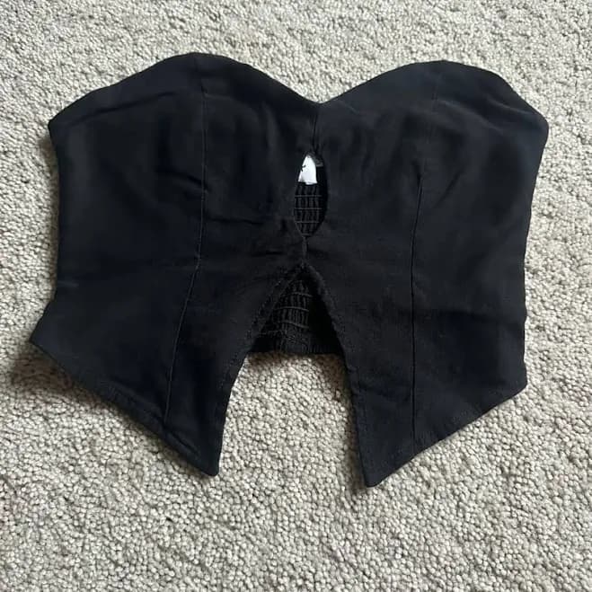 Princess Polly Tops | Princess Polly Black Strapless Bustier Top With Front Cutout | Color: Black | Size: 4 | Brooke_Stone's Closet