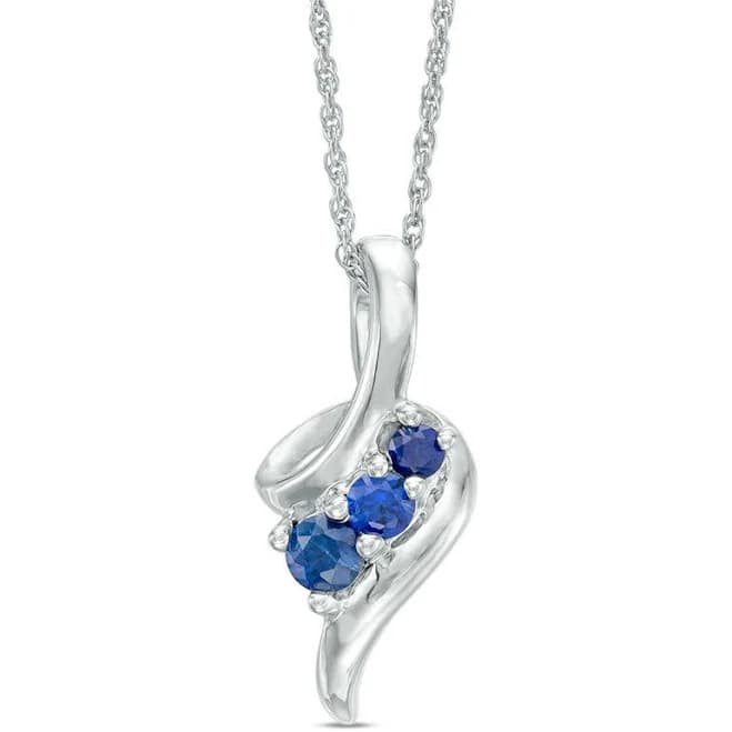 Zales Graduated Lab-Created Blue Sapphire Beaded Swirl Ribbon Pendant in