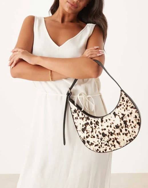 ASOS Design Pony Hair Asymmetric Scoop Cow Print Shoulder Bag