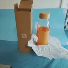 New Nespresso Reusable Glass Water Bottle with Orange Silicone Sleeve 500ml