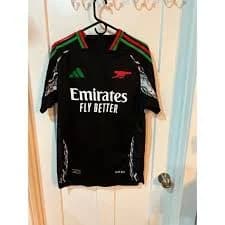 Adidas Arsenal FC 2024/25 Away Jersey, which is black with red and green accents