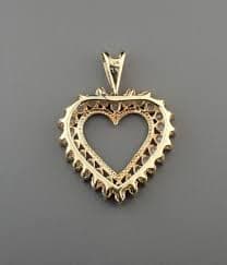Sold at Auction: DIAMOND & 10K GOLD OPEN HEART PENDANT