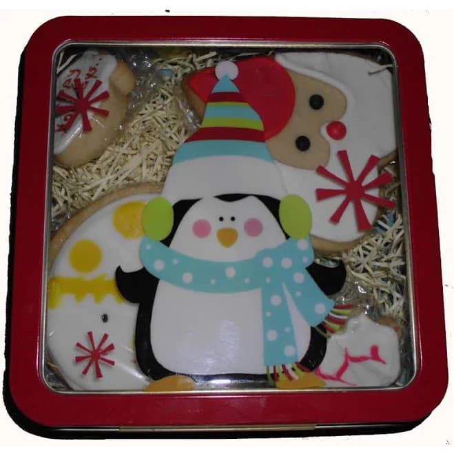 Decorated holiday cookies in a tin