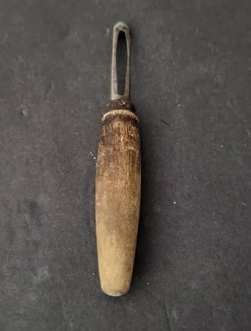 vintage peeler with a wood handle