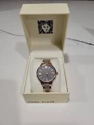 Anne Klein Women`s Rose Gold-tone and Light Pink Resin Bracelet Watch