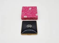 Kigu Vintage Powder Compact, Vintage Square Black Enamel with Marcasite Bow, Gold Cosmetic Case with Raised Bow, 1950s Pressed Powder