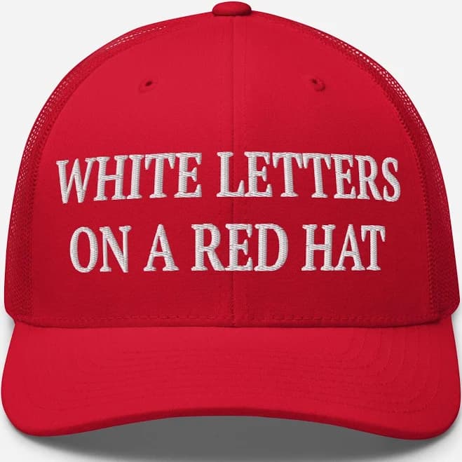 White Letters On A Red Hat Trucker Hat